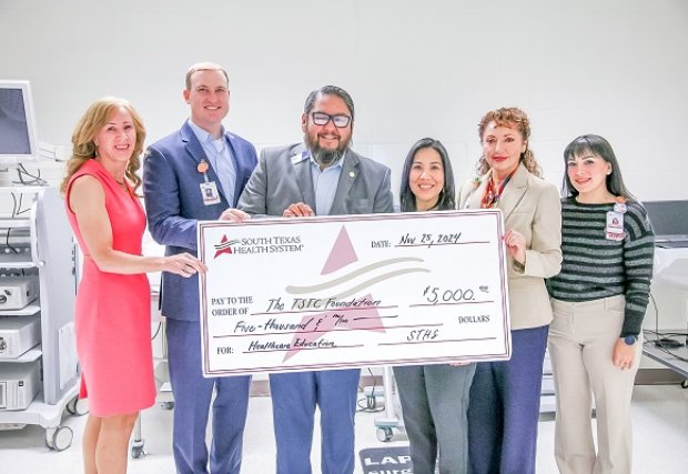 STHS staff posing with TSTC donation check