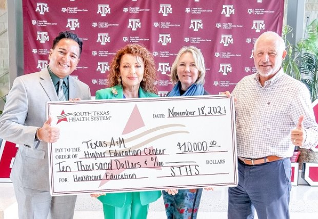 STHS McAllen Representatives standing with donation check